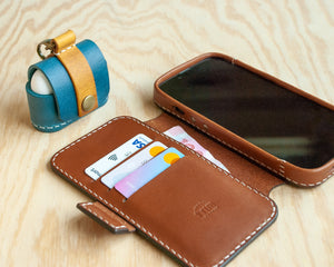 Saddle leather iPhone wallet folio open, showing card slots